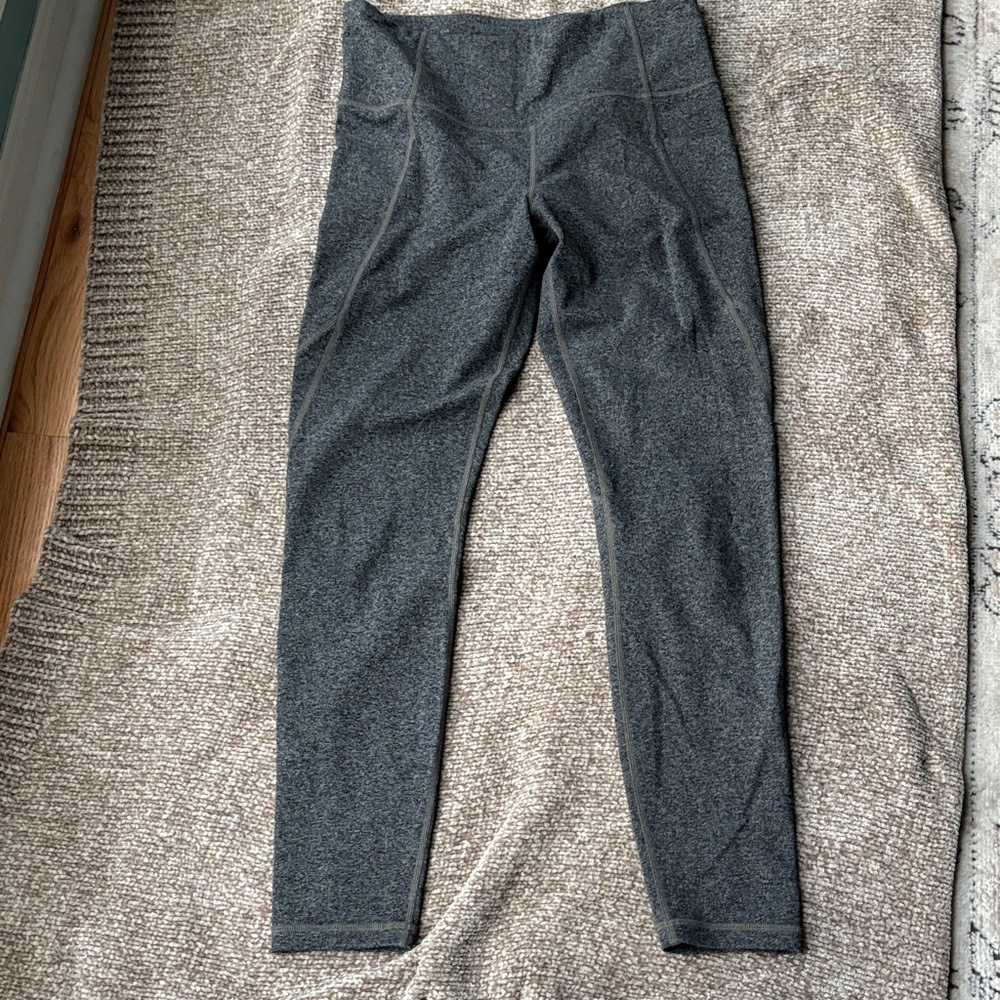 Grayish leggings with pockets. I think these are 7/8 length.